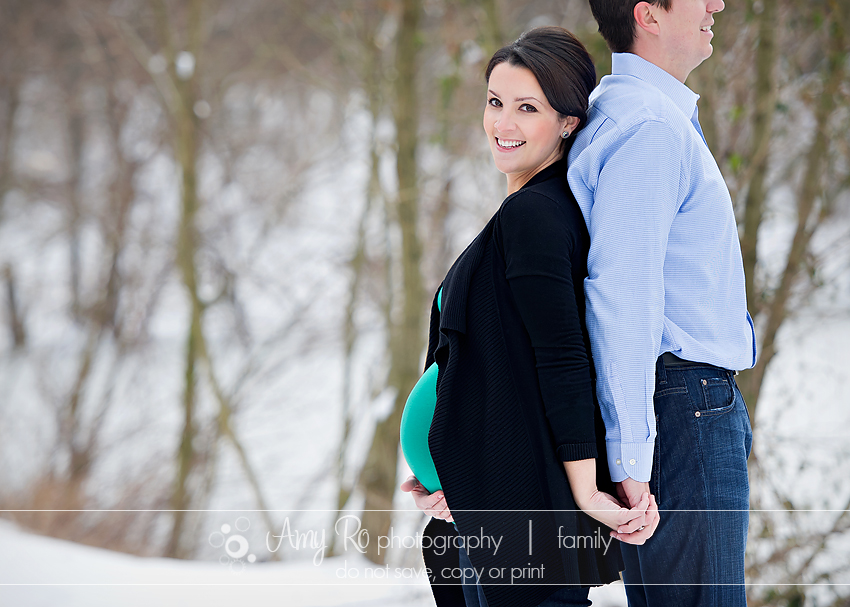Couples maternity image in the snow