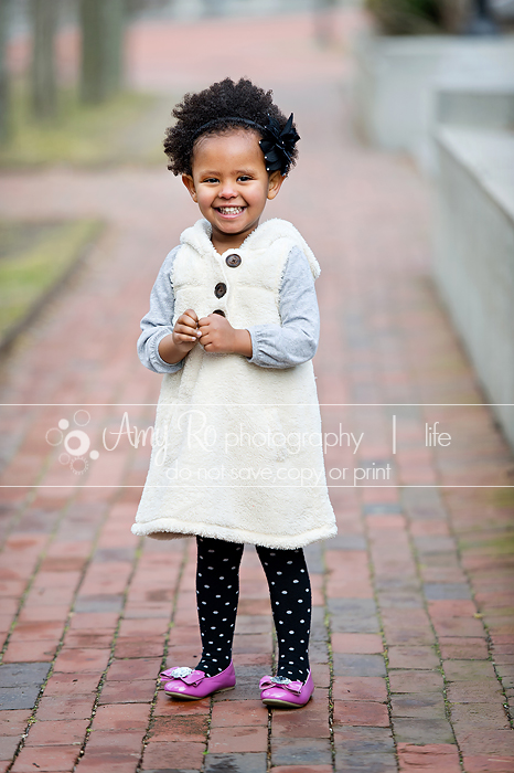 Toddler girl in white furry dress