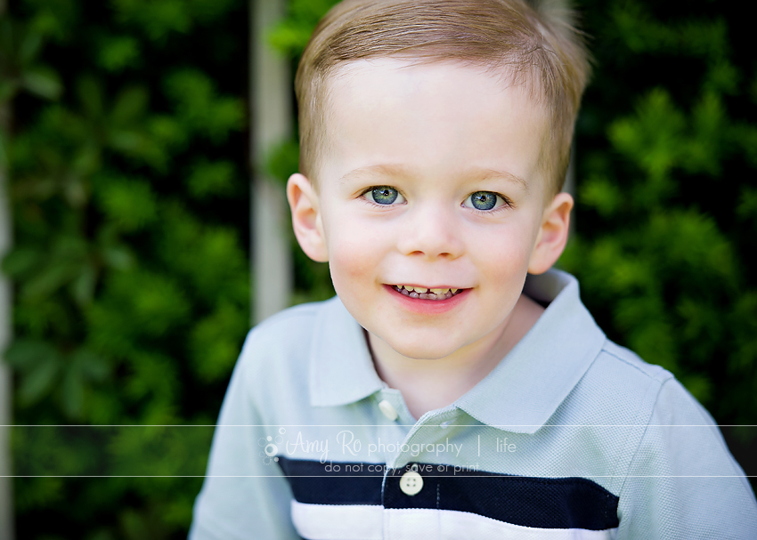 Portrait of a boy sitting on a bench