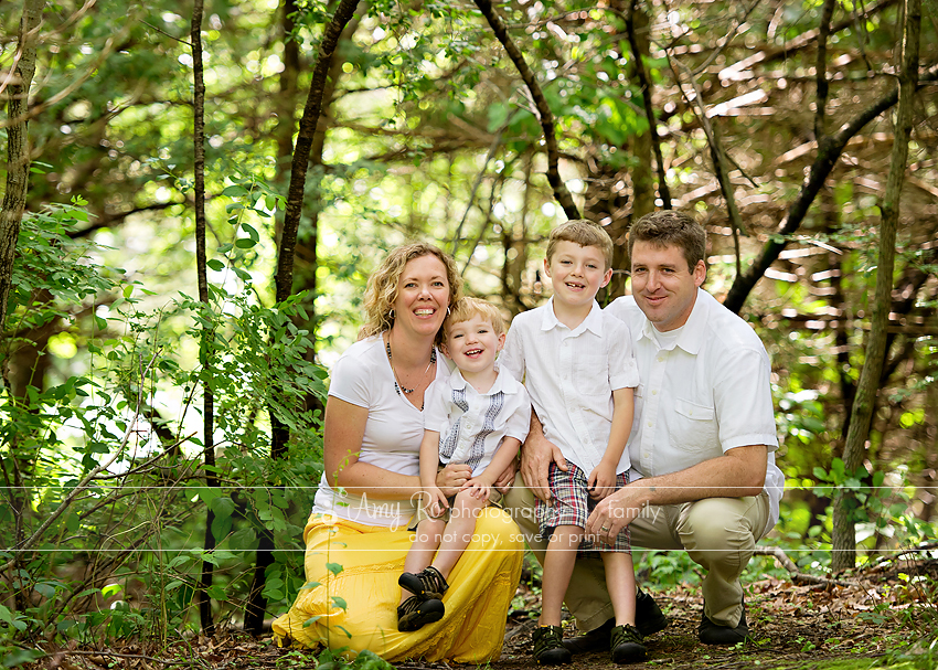 Family portrait in woods, white and yellow colors, Massachusetts family photography