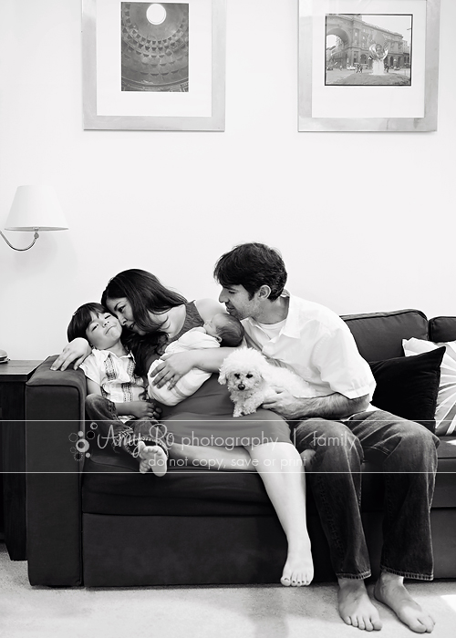 Family shot on couch with newborn and dog lifestyle