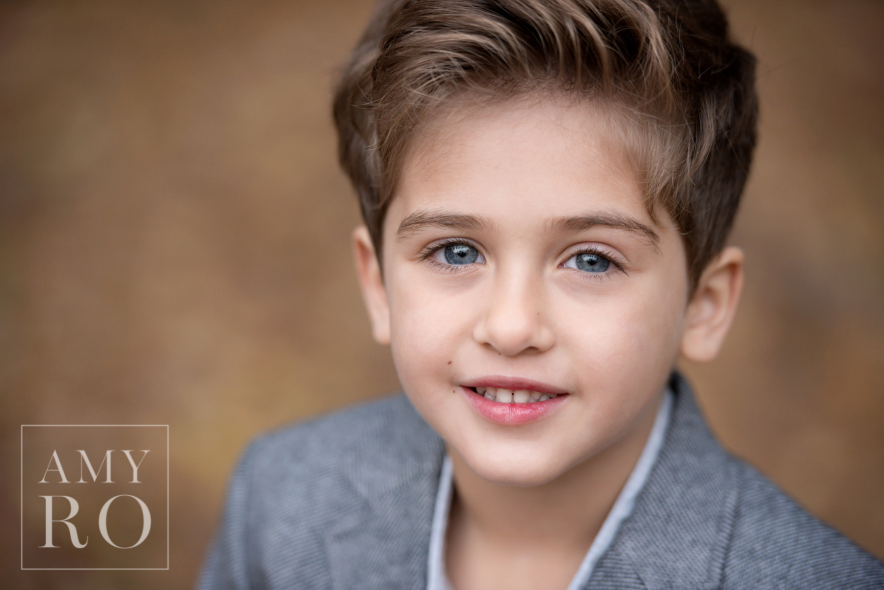 Gorgeous young boy image, bright blue eyes with brown hair