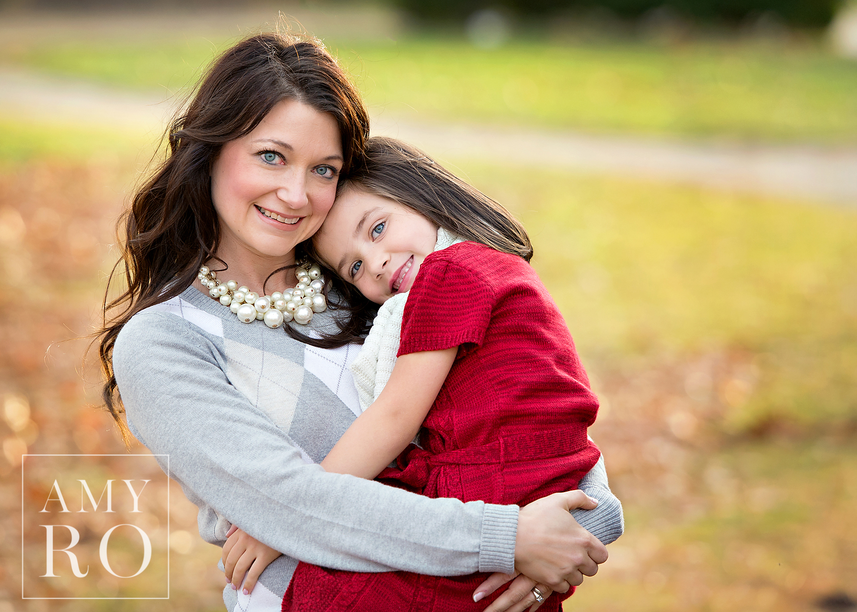 Image of mother and daughter during a family photography session in Roger Williams park in Rhode Island