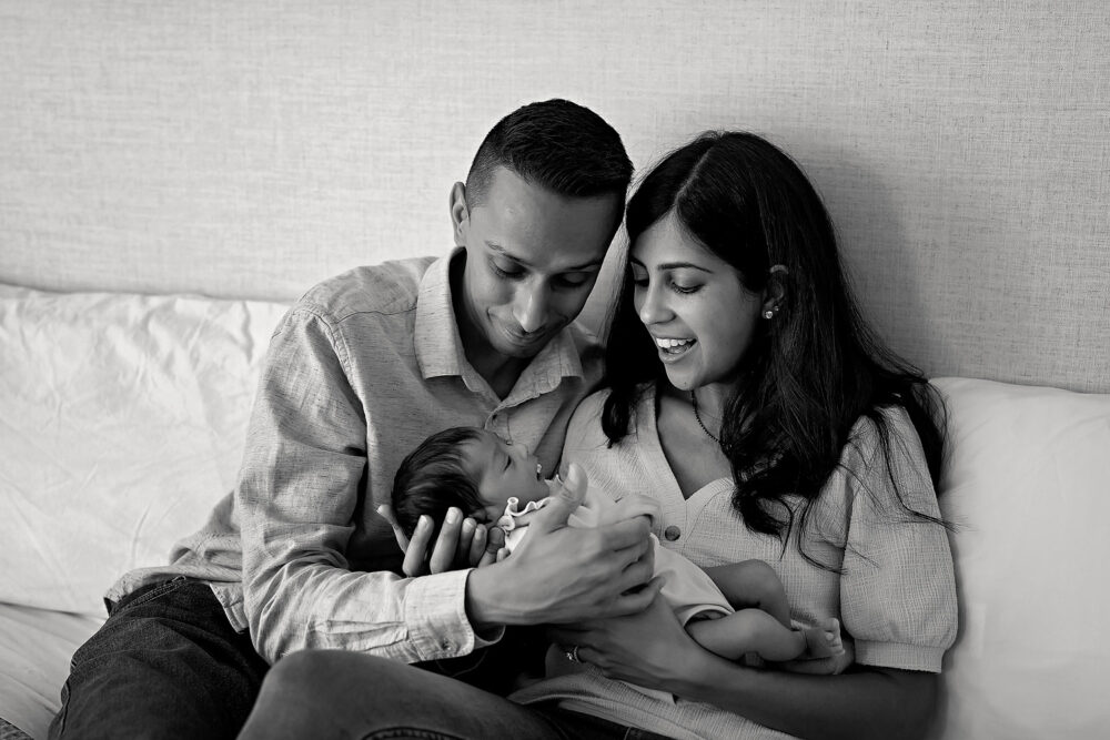 Mom and dad with newborn in lifestlye photos