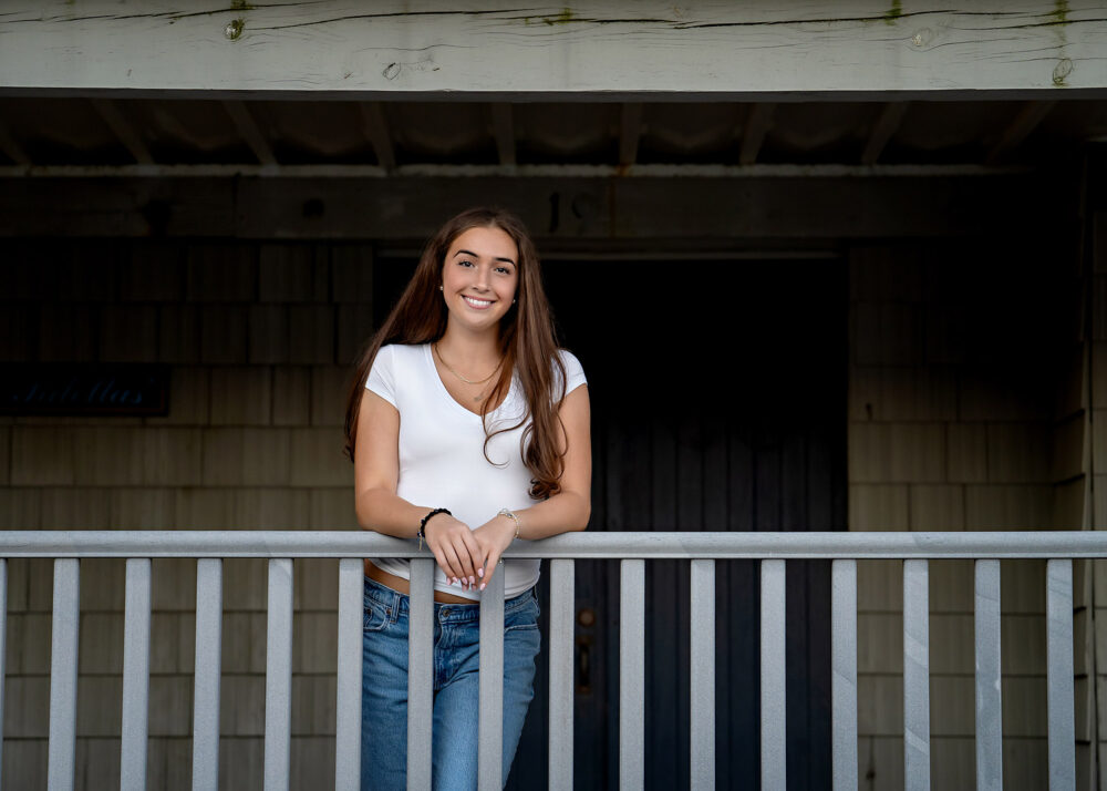 Senior leaning on railing during session at Bonnet Shores beach club