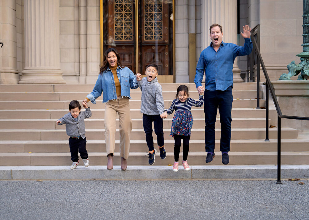 Family jumping on steps Brown University family session