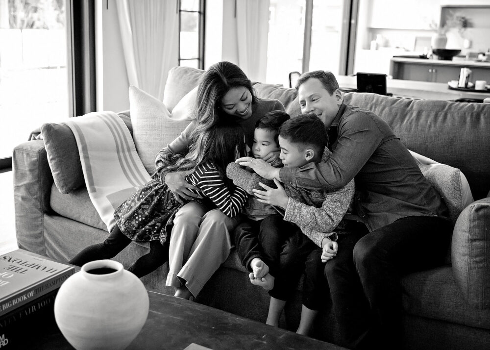 Family snuggles on cocuch curing lifestyle family session Providence RI