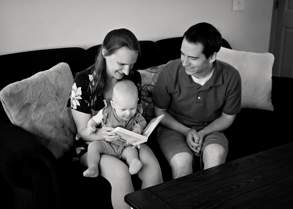 Mom and dad on couch during family photos in Providence RI