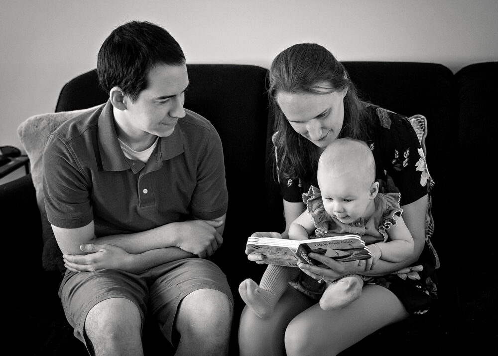 Reading book with baby during on location family session near Lincoln RI