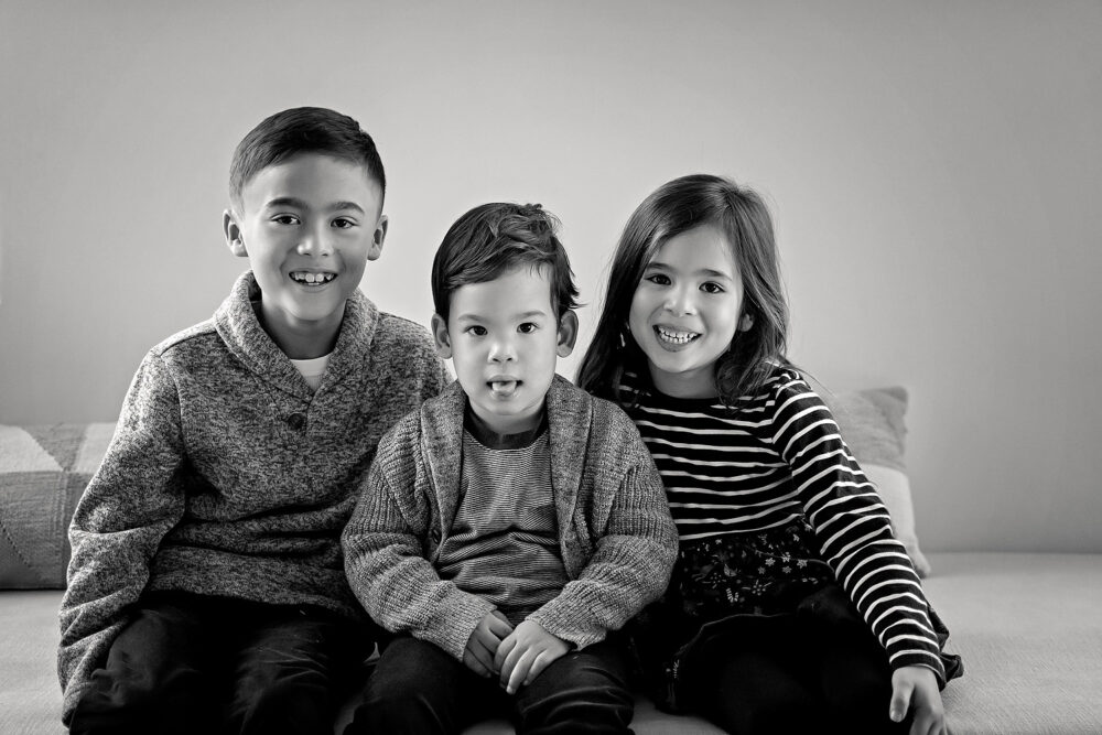 Siblings snuggling on location family session near Barrington RI