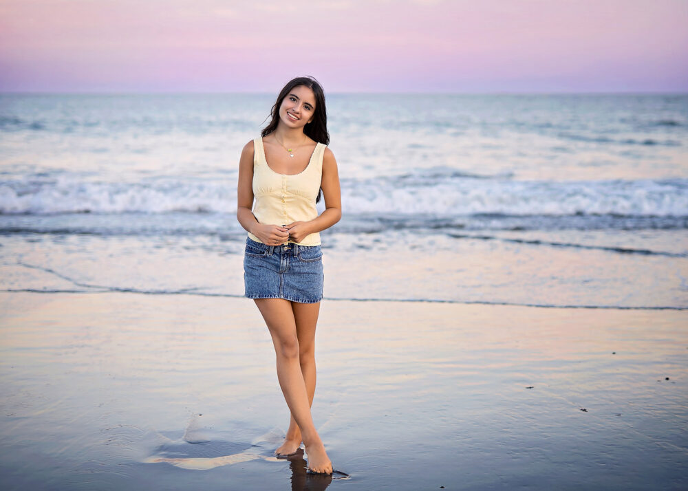 Senior girl standing on the ocean beach senior photos Scarborough Beach