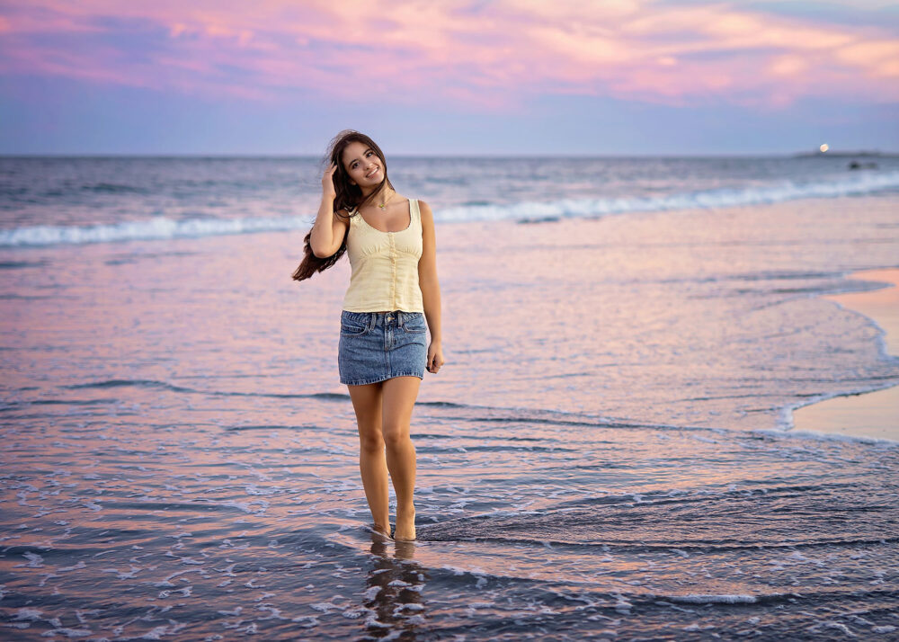 Pink and purple sunset at Scarborough beach senior girl photo in the water
