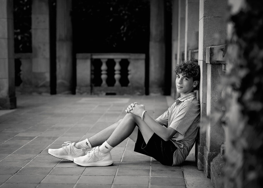 Senior boy sitting on the ground senior photos Waterford Connecticut