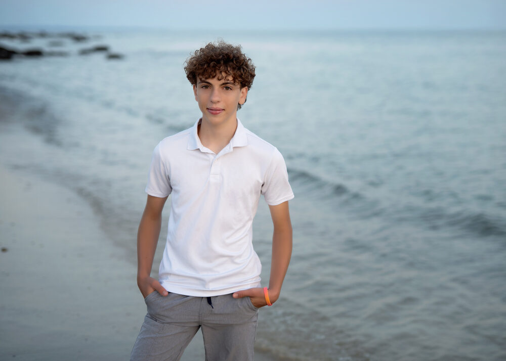 Senior boy on the beach at Harkness Memorial Park