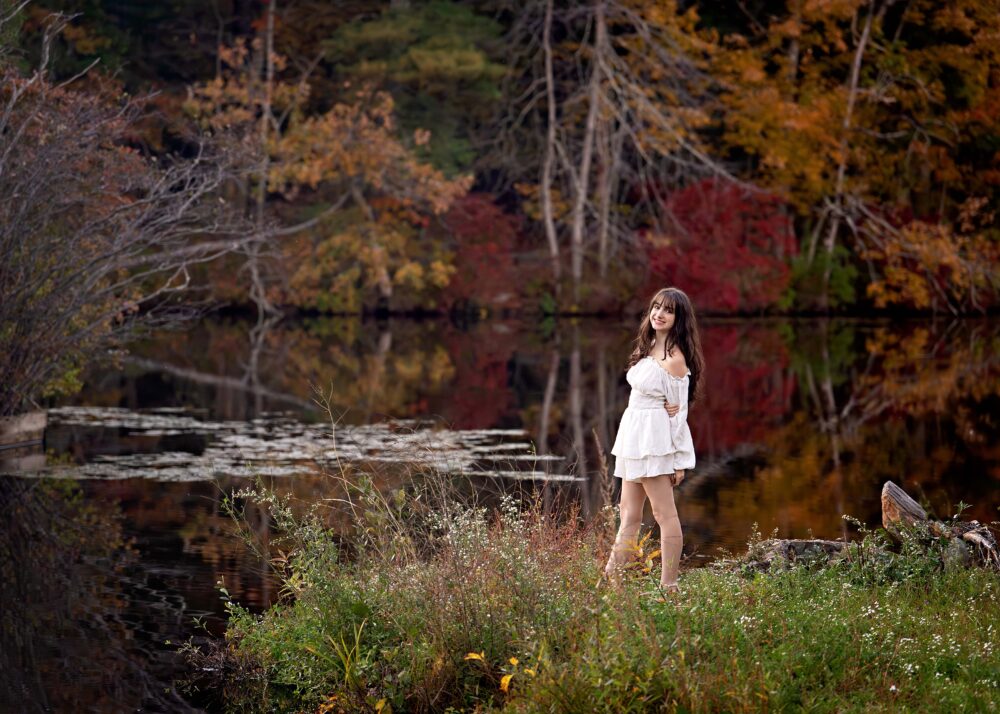 Senior girl in front of autumn leaves Camp Ker-Anna Cumberland Rhode Island